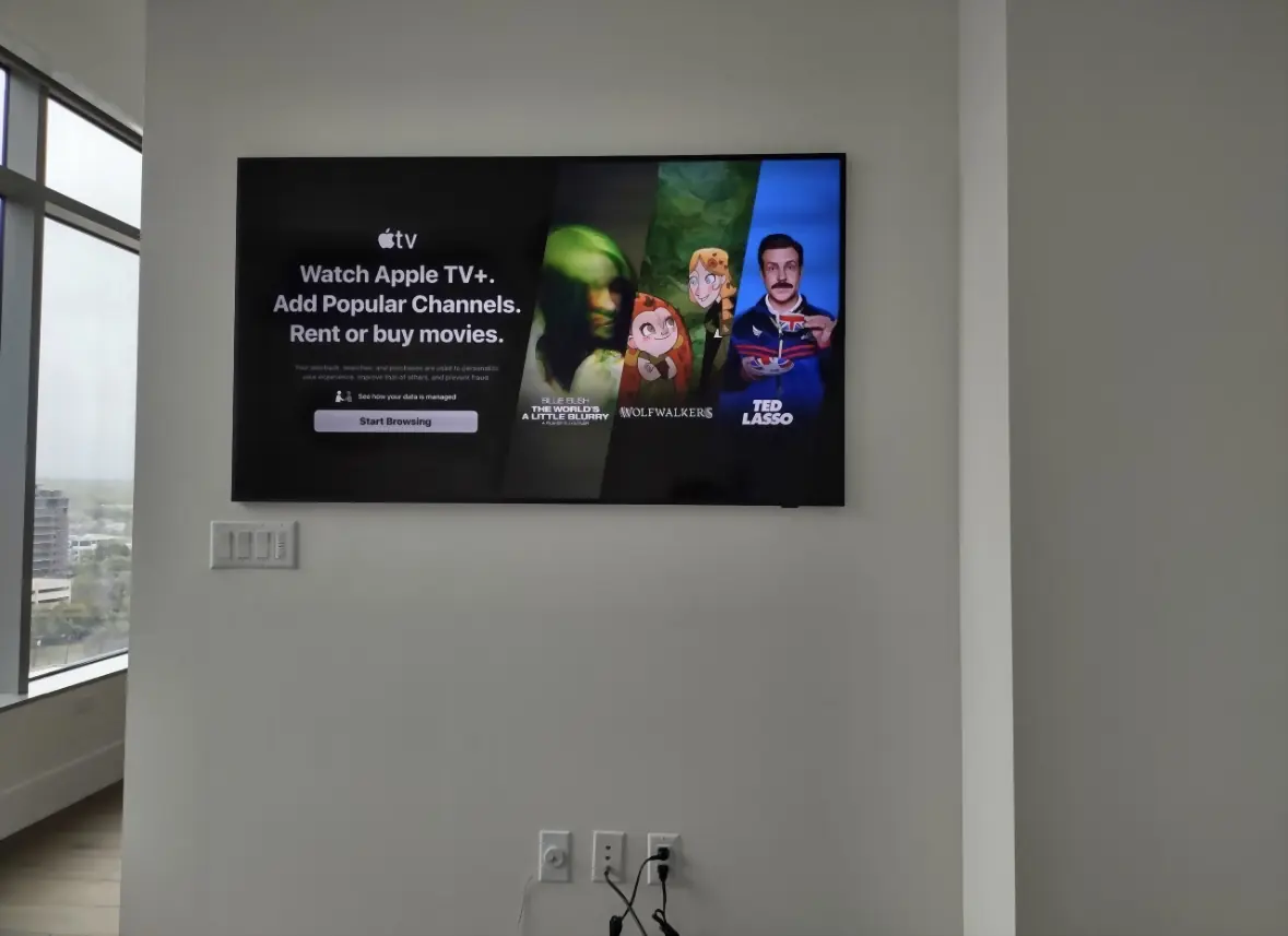 TV mounted on a clean wall in a high-rise Austin condo